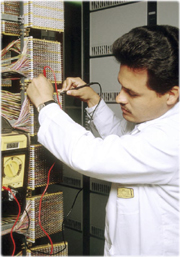 Emilio in a telephone connections room